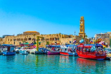 ACRE, ISRAEL, SEPTEMBER 12, 2018: Boats mooring in the old port  clipart