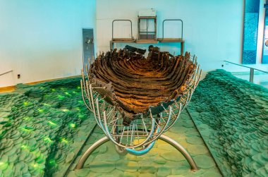 GINOSAR, ISRAEL, SEPTEMBER 15, 2018: An ancient wooden boat foun clipart