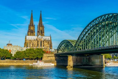 Cathedral in Cologne and Hohenzollern bridge over Rhein, Germany clipart