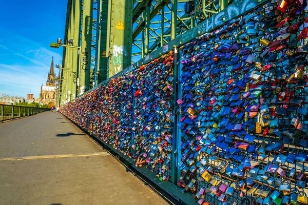 Detail of love locks on Hohenzollern bridge in Cologne with the — Stock Photo, Image