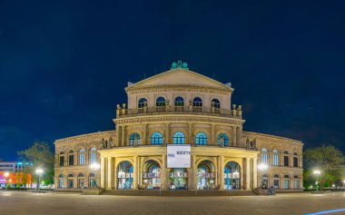 HANNOVER, GERMANY, APRIL 28, 2018: People are strolling in front of the state opera in Hannover, Germany clipart