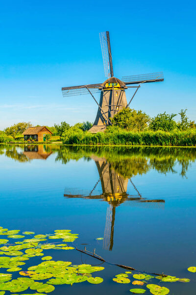 Kinderdijk windmills viewed during sunny summer day, Rotterdam, 