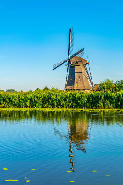 Kinderdijk windmills viewed during sunny summer day, Rotterdam, 
