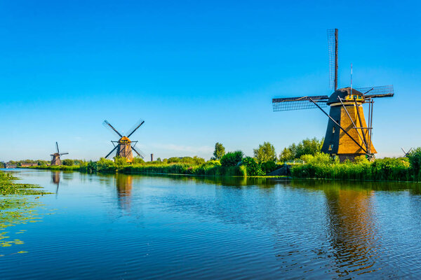 Kinderdijk windmills viewed during sunny summer day, Rotterdam, 