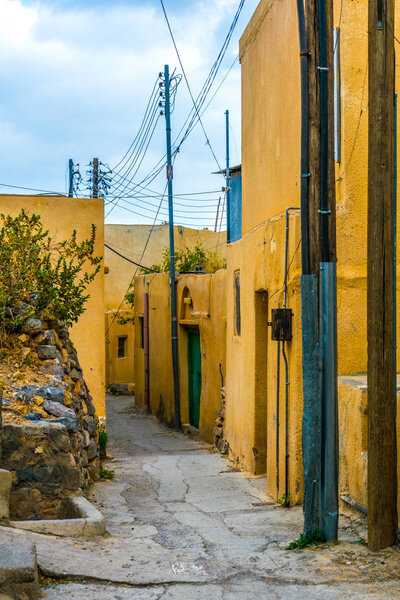 View of a narrow street of a village at the Jebel Akhdar mountain in Oman.