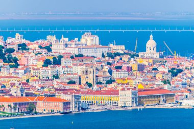 View of Lisbon  with praca do comercio square, national pantheon and sao vicente church from Tajo river, Portugal. clipart