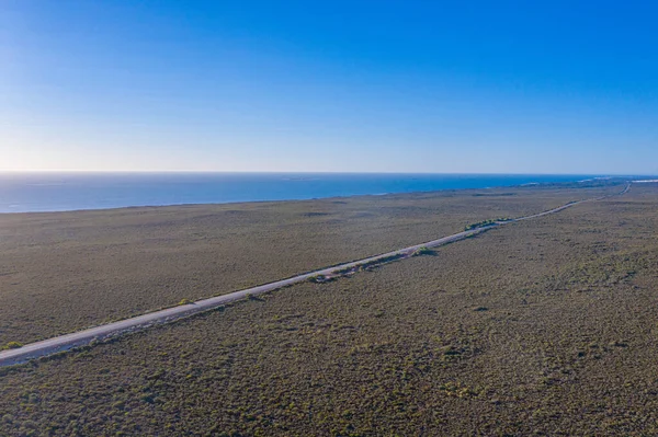 Road passing sea in Western Australia