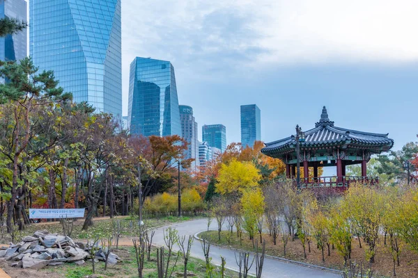 Wooden pavilion with skyscrapers on background at Yeouido island in Seoul, Republic of Korea