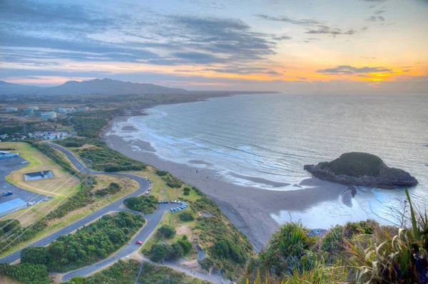 Sunset aerial view of coast of New Zealand from Paritutu rock near New Plymouth