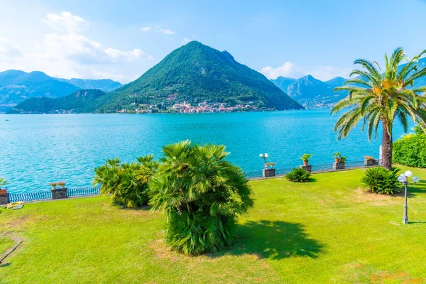 stock image Peschiera Maraglio village on Monte Isola island viewed behind a garden in Italy