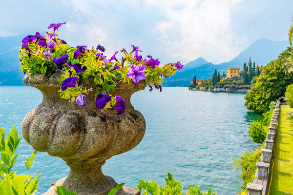 Villa Cipressi viewed from behind of flowers at Varenna in Italy