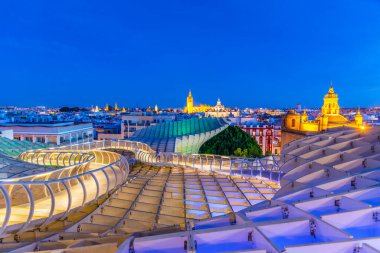 Churches in Sevilla viewed from Setas de Sevilla mushroom structure, Spain clipart