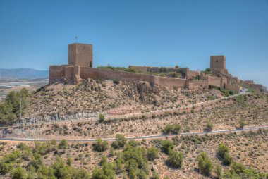 Castle in lorca overlooking the town, Spain clipart