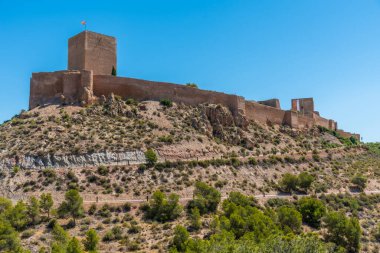 Castle in lorca overlooking the town, Spain clipart