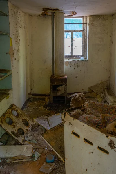 Broken interior of a village house in the Chernobyl Exclusion Zone in the Ukraine