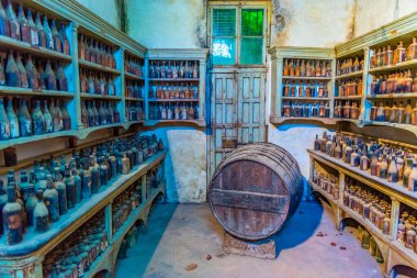 JEREZ DE LA FRONTERA, SPAIN, JUNE 26, 2019: Wine barrels inside of Bodega of Tio Pepe at Jerez de la Frontera in Spain clipart