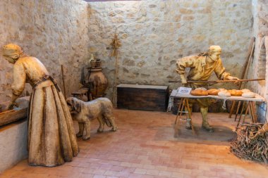 LORCA, SPAIN, JUNE 20, 2019: Reconstruction of medieval bakery inside of Lorca castle in Spain clipart