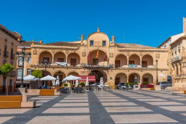 LORCA, SPAIN, JUNE 20, 2019: People are strolling on Plaza de Espana in Spanish town Lorca clipart