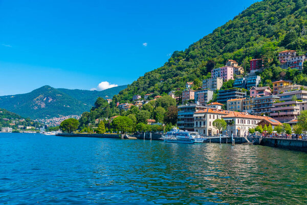 COMO, ITALY, JULY 17, 2019: Lakeside promenade alongside lake Como in Italy