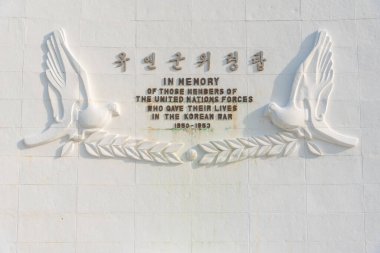 BUSAN, KOREA, OCTOBER 29, 2019: White monument at United Nations memorial cemetery in Busan, Republic of Korea clipart