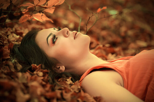 Beautiful girl posing in nature at beautiful autumn day