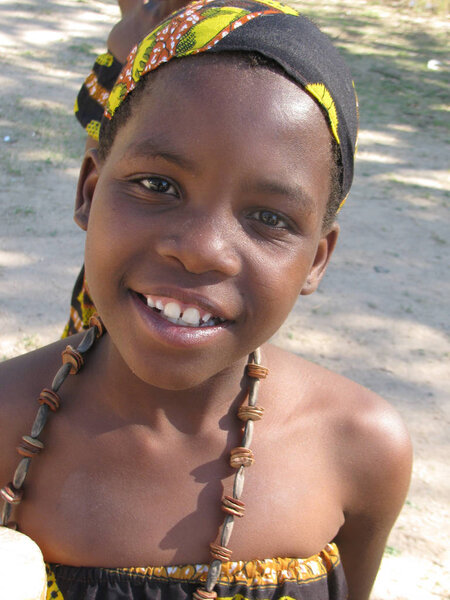    Chegutu,Zimbabwe,October 27 2015.Portrait of   smiling   schoolgirl  dressed in  traditional style beads and dressing. .                                                     