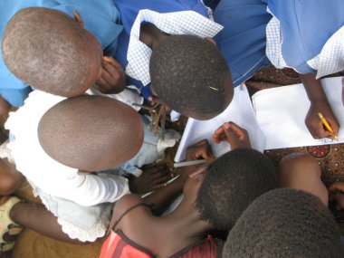 Chibero,Zimbabwe,September 28 2016.Top view  of  primary  school children  involved in  group  activities  outside  their  classroom  at  school. clipart