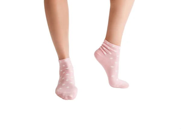 Well-groomed female feet in pink socks, closeup, isolated on white — Stock Photo, Image