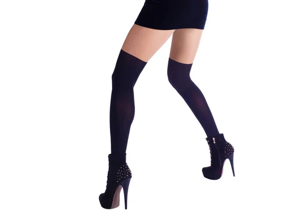 Sexy female legs in black spats, fitting dress and ankle boots. Isolated on white — Stock Photo, Image