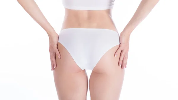 Feminino corte ajuste nádegas em calcinha branca base, isolado em branco . — Fotografia de Stock