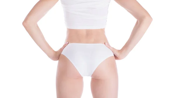 Feminino bem preparado corte ajuste nádegas e costas em roupa interior branca base, isolado em branco . — Fotografia de Stock