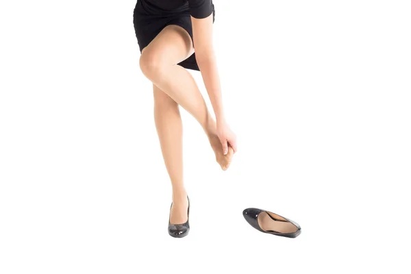 Woman take off her highheel tight shoe and mass her weary bare foot. — Stock Photo, Image