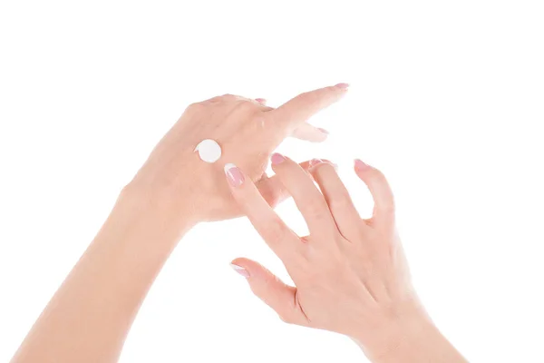 Hermosas manos femeninas con crema, aisladas en blanco —  Fotos de Stock