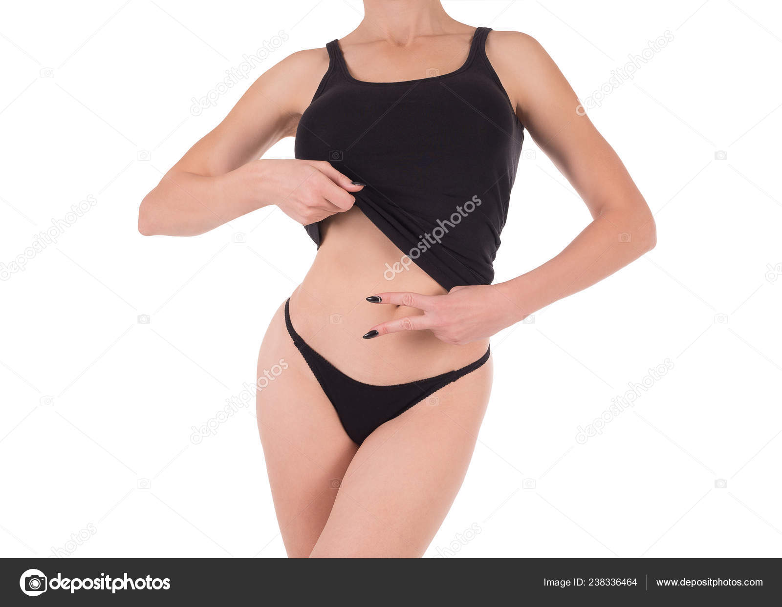 Female cropped fit body in black tank top and panties, isolated on white.  Stock Photo by ©n.k.junky 238336464