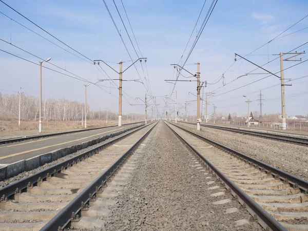 Empty railway station, lines and wires, wide angle, selective focus — Stock Photo, Image