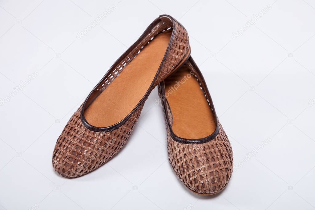 New brown shoes on white background