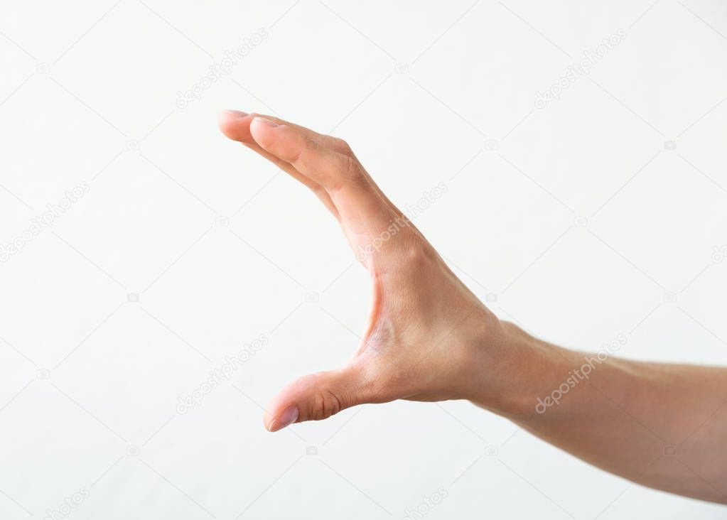 Female hand shows some distance /size, white background