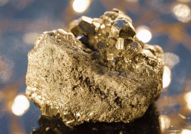 Stone pyrite on a beautiful glowing background clipart