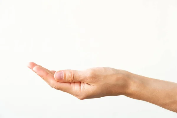 Mão feminina sobre um fundo branco. Gesto de oferta ou pedido . — Fotografia de Stock