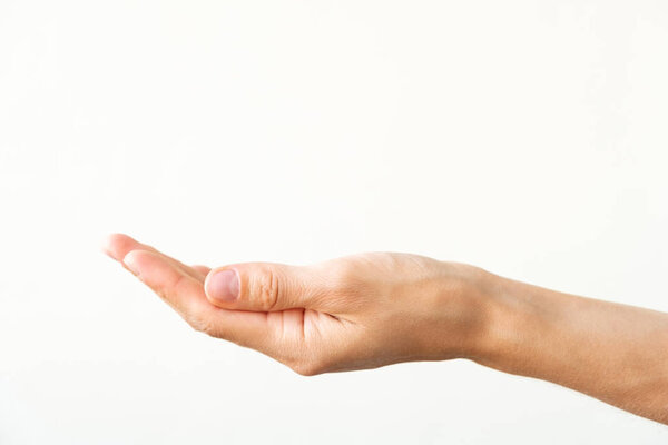 Female hand on a white background. Gesture of offer or request.