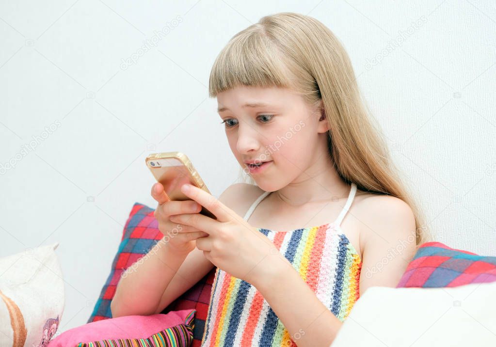 Teen girl uses a mobile phone