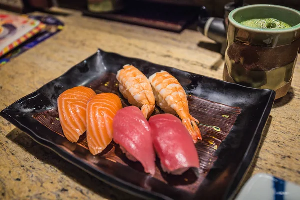 Assorted sushi set on a ceramic plate from a Japanese Sushi shop in Kyoto, Japan