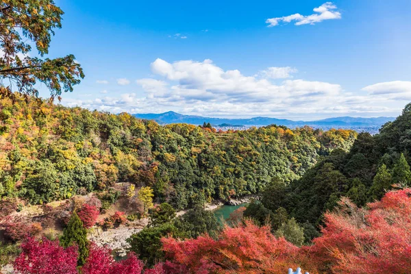 colorful of maple forest on the mountain at autumn season in Arashiyama, Kyoto, Japan. From observation view point at Senkoji temple, over hozu river.