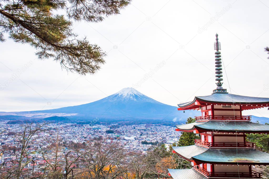 Autumn scene of Mount Fuji with Chureito pagoda and Fujiyoshida city from Arakurayama sengen park, Yamanashi, Japan.