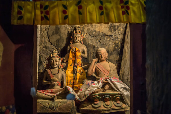 These statues that placed in small cave where Indian master Naropa meditated in 11th century, In front on left is most likely Taktsang Repa and on right Milarepa at Lamayuru Monastery