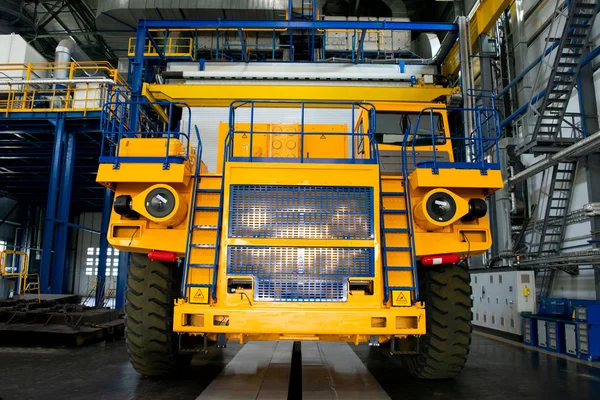 Big mining truck in the production shop of the car factory. Belaz is a Belarusian manufacturer of haulage and earthmoving equipment, dump trucks, haul trucks, heavy equipment.