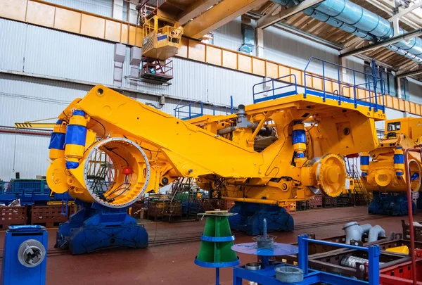 Line, conveyor for the production of large yellow trucks, mining trucks. Shop factory. Belaz is a Belarusian manufacturer of haulage and earthmoving equipment, dump trucks, haul trucks, heavy equipm
