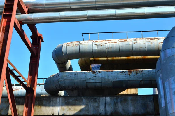 Industrial cables and pipes in a thermal power plant.