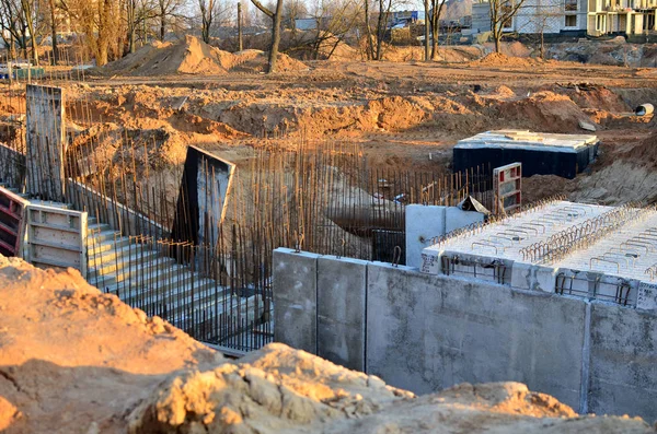 Monolithic concrete structure in the foundation pit during the construction of a new underground pedestrian crossing in the subway