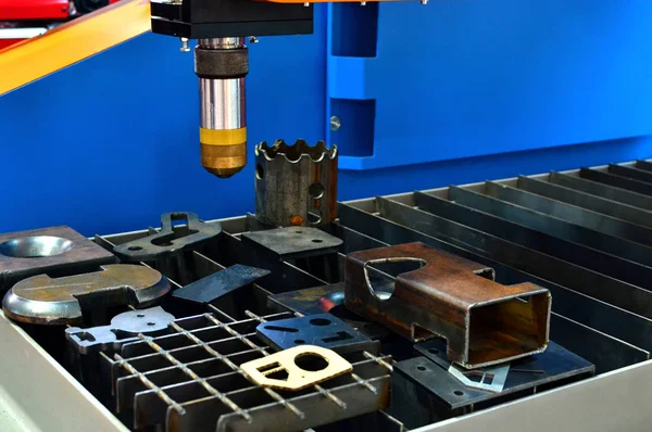 CNC Laser cutting of metal, modern industrial technology, close-up.